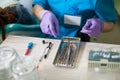 Close-up of the hands of the doctor holding dental instruments Royalty Free Stock Photo