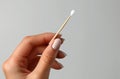 Close up of hands doing a french manicure on a white background, closeup view of a woman hand with a nail file and Royalty Free Stock Photo