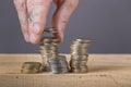 Close up of hands dropping euro coins