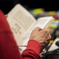 Close-up of hands of the elderly person with book, bookstore, library. Real scene. Education, Self-study, reading Royalty Free Stock Photo