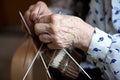 Close up of the hands of an old woman knitting sock Royalty Free Stock Photo