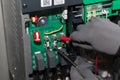 Close-up of hands electric fuse testing