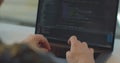 Close up hands engineers developing software app using digital laptop computer typing code on screen programmers coding Royalty Free Stock Photo