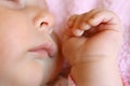 Close up on Hands and Face of Sleeping Baby Royalty Free Stock Photo