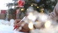 Close up hands of female writing letter and wish list at Christmas Eve. Girl writing in notebook. Woman hand holding pen Royalty Free Stock Photo