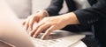 Close up hands and fingers of business man using laptop computer working from home, new normal social distancing, work from home Royalty Free Stock Photo