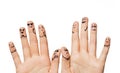 Close up of hands and fingers with smiley faces Royalty Free Stock Photo