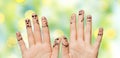 Close up of hands and fingers with smiley faces Royalty Free Stock Photo