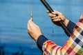 Close-up of the hands of the fisherman. Fisherman holding a fishing pole, bobber and hook Royalty Free Stock Photo