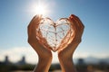 Close-up of hands framing a heart shape in the sky - stock photography concepts