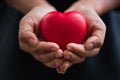 Close up hands giving red heart as heart donor. Valentine day of love concept. Medical ventilator and heart donator charity. Sign