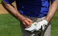 Golfer keeping score on scorecard Royalty Free Stock Photo