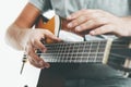 Close-up on the hands of a guitarist playing classical guitar in an unusual technique Royalty Free Stock Photo