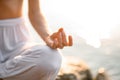 close-up of hands, gyan mudra and lotus position. Fragment of woman practicing yoga