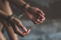 Close-up of hands in handcuff, Female prisoner, Arrested woman Royalty Free Stock Photo