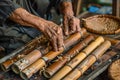 Close-up of the hands of a handicraftsman making bamboo weaving. Ai generated