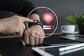 Close up of hands with heart icon on smart watch Royalty Free Stock Photo