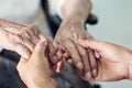 Close up hands of helping hands for elderly home care.