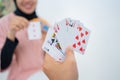 Close up of hands holding cards while playing cards Royalty Free Stock Photo