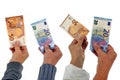 Crowdfunding concept with banknotes in hand on white background