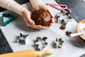 close up of hands holding gingerbread dough