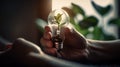 Close up of hands holding light bulb with green plant inside. Ecology and environment concept. Generative AI Royalty Free Stock Photo