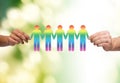 Close up of hands holding paper chain gay people Royalty Free Stock Photo