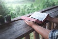 Close up hands holding and reading a holy bible. christian concept