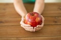 Close up of hands holding ripe red apple Royalty Free Stock Photo