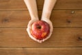 Close up of hands holding ripe red apple Royalty Free Stock Photo