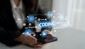 Hands Holding Smartphone with Coding Concept and Technology Iconography for Software Development, Data Management, and Royalty Free Stock Photo