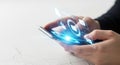 Close up of hands holding smartphone with futuristic glowing digital network connecting data streams Royalty Free Stock Photo