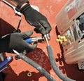 Close-up of the hands of an installer technician cutting with a special tool the copper pipes for the assembly of a new air condit Royalty Free Stock Photo