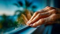 Close-up of hands installing weatherstripping on a window frame to reduce drafts and improve home energy efficiency Royalty Free Stock Photo