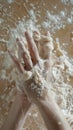 Hands kneading sticky dough with flour on a messy surface Royalty Free Stock Photo