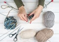 Close-up of hands knitting. Colorful threads. Selection of colorful yarn wool. Knitting background. Knitting yarn for