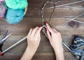 Close-up of hands knitting. Colorful threads. Selection of colorful yarn wool. Knitting background. Knitting yarn for