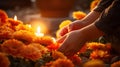 Close-up of hands lighting candles between flowers on graves. Generative Ai. Royalty Free Stock Photo