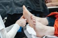 Close-up of hands mading foot care session therapeutic procedure