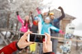 Close up of hands making photo with cell phone