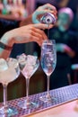 Close up of hands of male bartender pouring, mixing ingredients while making classic cocktail alcoholic drink at the bar Royalty Free Stock Photo