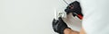 Close up of hands of male worker, professional electrician in protective gloves using screwdriver while installing new Royalty Free Stock Photo