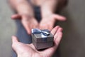 Close Up on hands man giving a small gray gift box to woman for Birthday, Christmas and New year, wedding, Valentines day Royalty Free Stock Photo