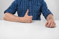 Close-up hands of man showing thumbs up. Hand gesture.