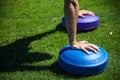 Close-up of hands of a man who is training and doing push-ups with balance tray Royalty Free Stock Photo