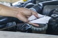 Close up hands of mechanic doing car service and maintenance. Oil and fuel filter Checking changing repair.