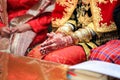 Close up hands and nails of Asian Muslim bride with henna paint tattoo and jewelry in a wedding ceremony Royalty Free Stock Photo