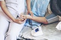 Hands nurse measuring blood pressure of senior elderly woman in hospital bed patients Royalty Free Stock Photo