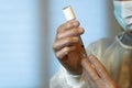 Close-up of the hands of a nurse preparing an injectable dose of a vaccine