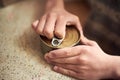 Close up hands opening a tin in the kitchen Royalty Free Stock Photo